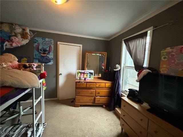 bedroom with carpet floors and ornamental molding