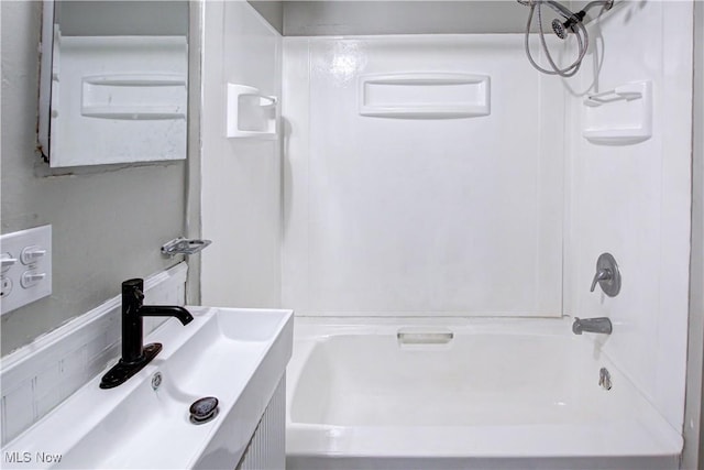 bathroom with vanity and shower / washtub combination