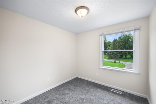 unfurnished room featuring carpet flooring