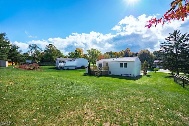 view of yard featuring a wooden deck