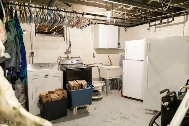 washroom featuring independent washer and dryer and sink