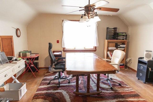 office featuring ceiling fan, light hardwood / wood-style floors, and lofted ceiling