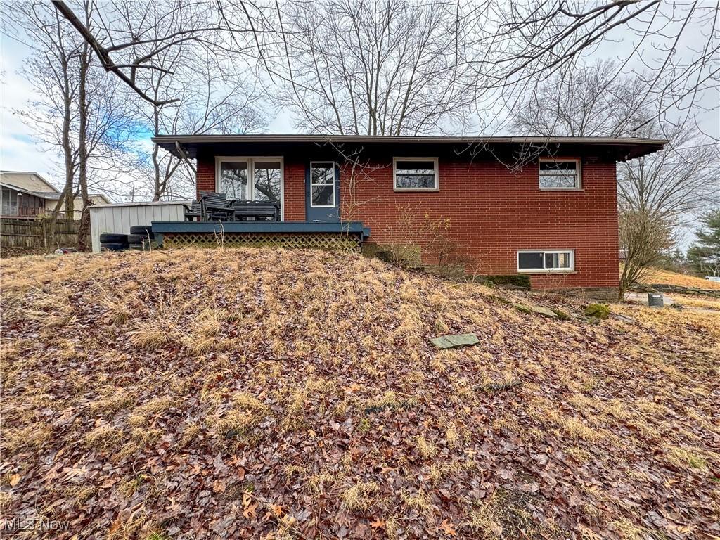 view of front of house featuring a wooden deck