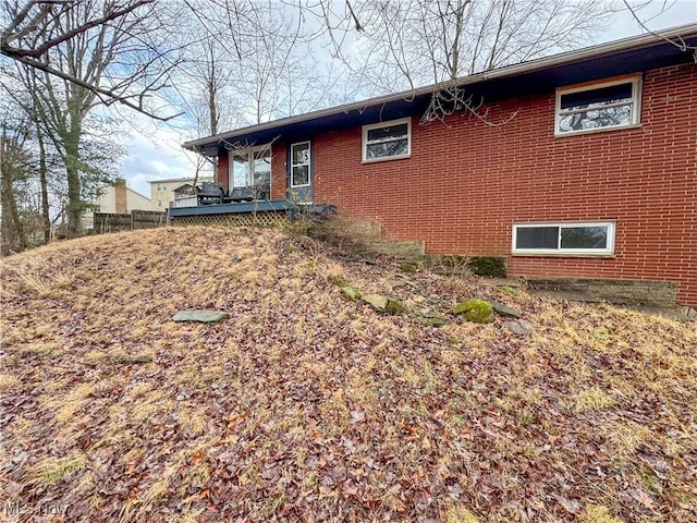 view of side of property featuring a deck