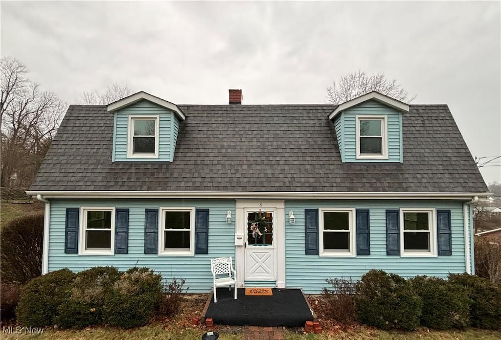 view of new england style home