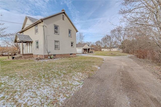 view of property exterior featuring a lawn