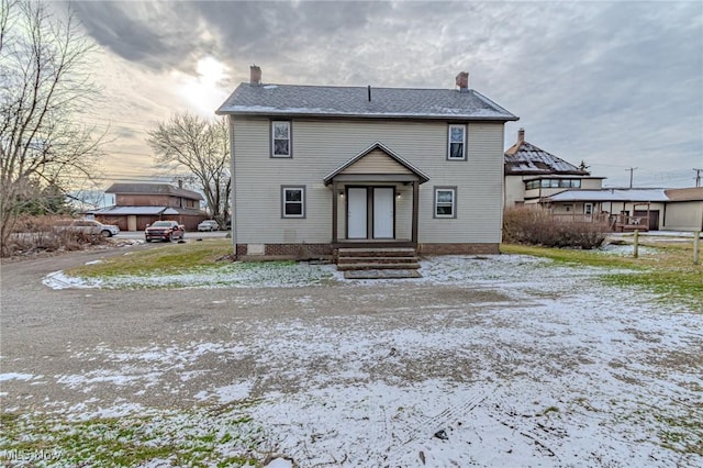 view of snow covered house