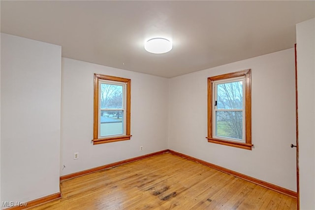 unfurnished room featuring light wood-type flooring