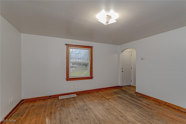 spare room featuring hardwood / wood-style flooring