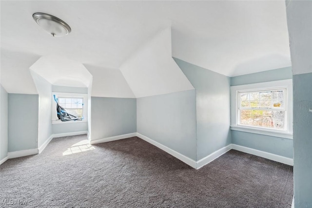 bonus room featuring carpet flooring and lofted ceiling