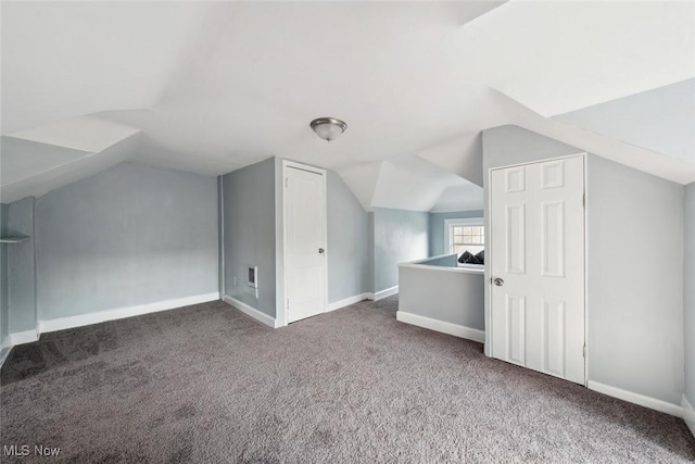 bonus room featuring lofted ceiling and carpet floors