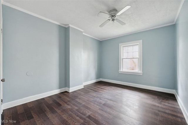 spare room featuring ceiling fan, dark hardwood / wood-style flooring, ornamental molding, and a textured ceiling