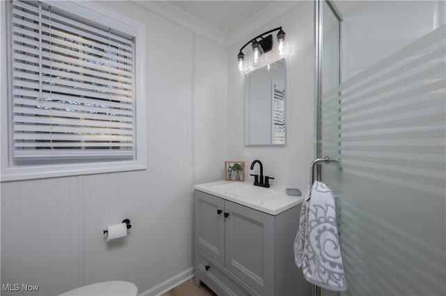 bathroom with vanity and ornamental molding