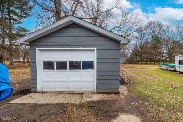 garage with a lawn