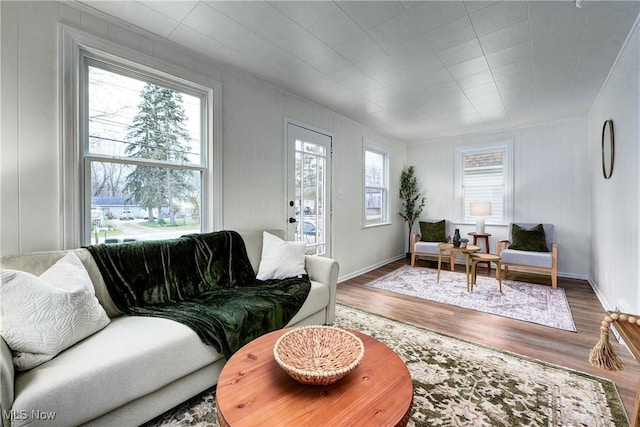 living room with a healthy amount of sunlight and hardwood / wood-style floors