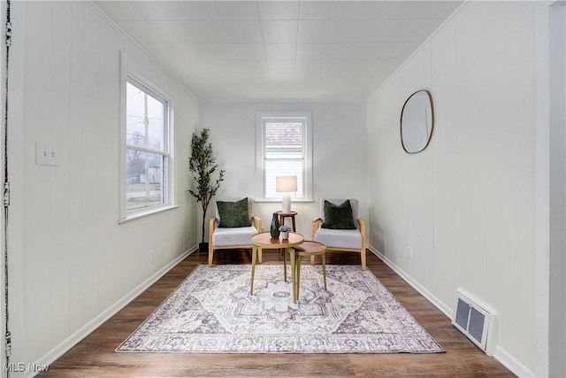 living area with dark hardwood / wood-style flooring