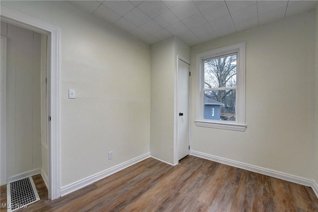 empty room featuring hardwood / wood-style flooring