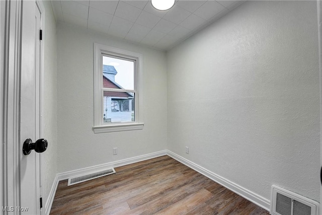 empty room featuring hardwood / wood-style flooring