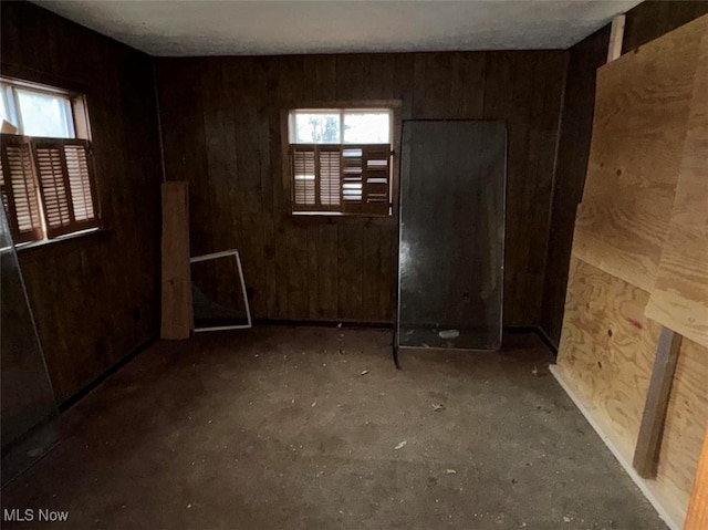 empty room with wooden walls