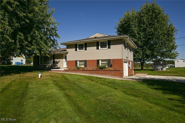 back of property featuring a lawn