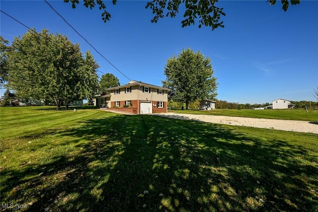 view of yard with a garage