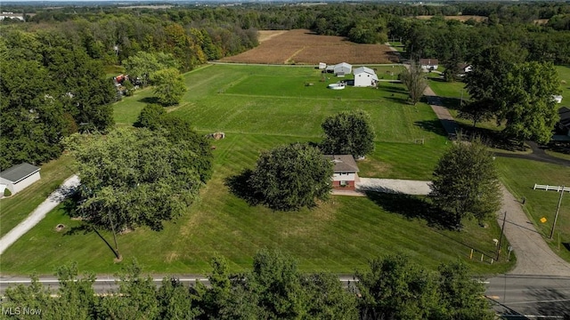 birds eye view of property with a rural view