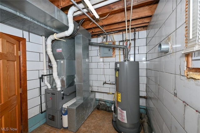 utility room featuring heating unit and water heater