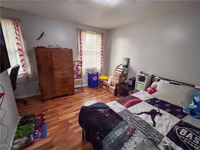 bedroom featuring wood-type flooring