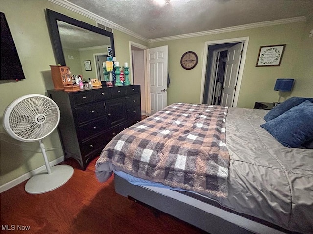 bedroom featuring ornamental molding and a textured ceiling