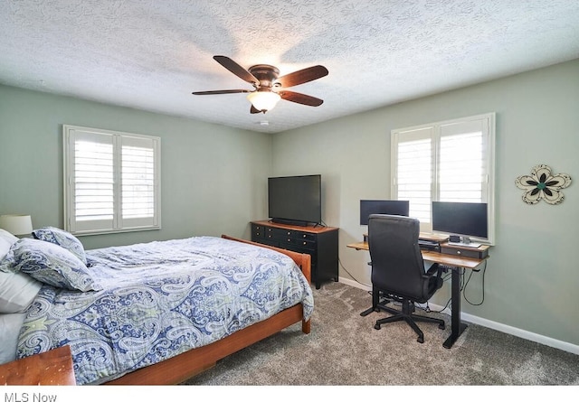 carpeted bedroom with multiple windows, a textured ceiling, and ceiling fan