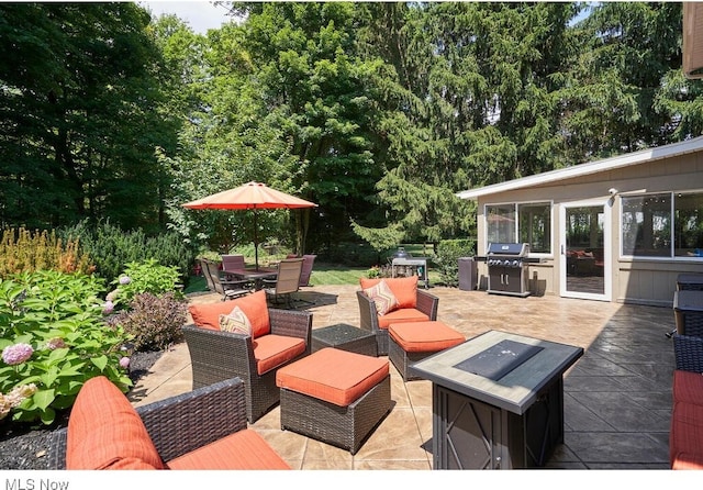 view of patio with an outdoor living space and area for grilling