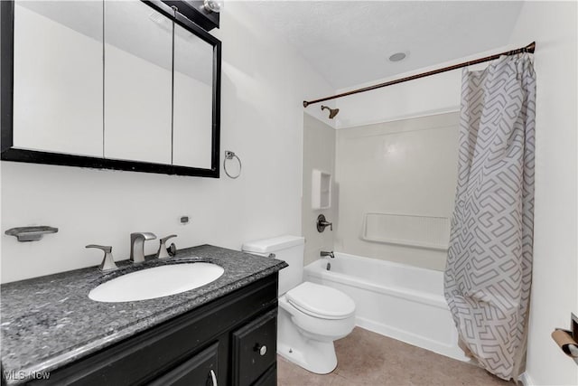 full bathroom featuring vanity, tile patterned floors, shower / bath combination with curtain, toilet, and a textured ceiling