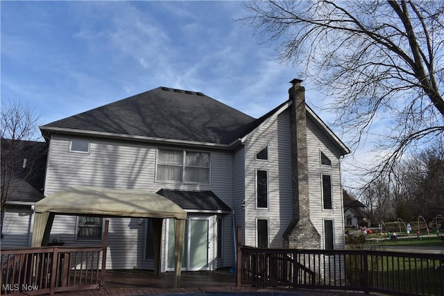 back of house with a wooden deck