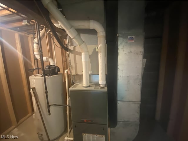 utility room with gas water heater