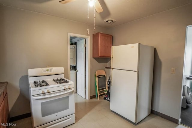 kitchen featuring ceiling fan and white appliances