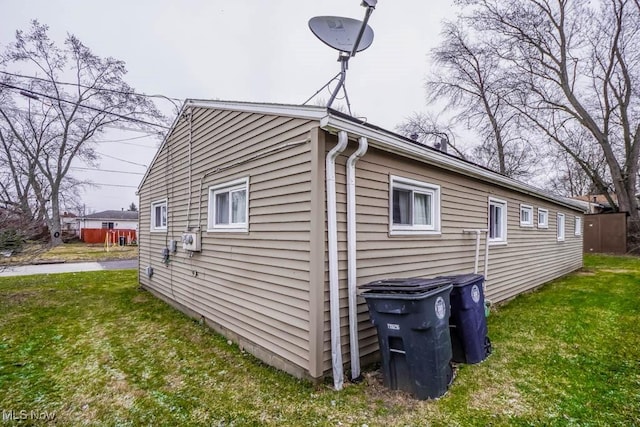 view of property exterior with a yard