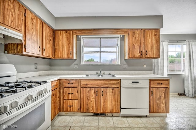 kitchen featuring sink and white appliances