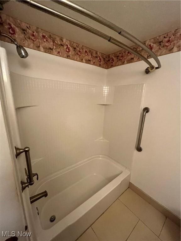 bathroom featuring tile patterned flooring and bathtub / shower combination