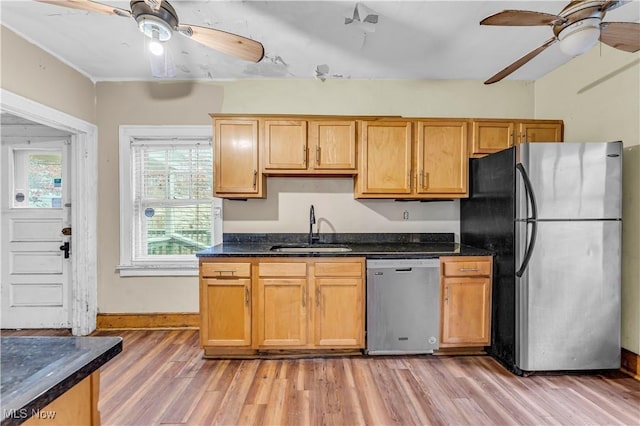 kitchen with ceiling fan, sink, light wood-type flooring, and appliances with stainless steel finishes