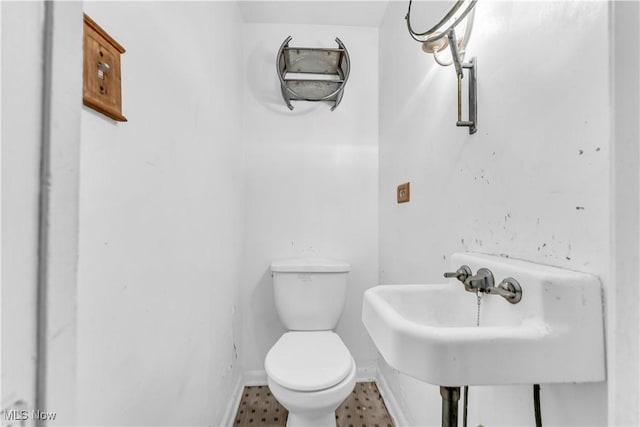 bathroom with toilet and sink