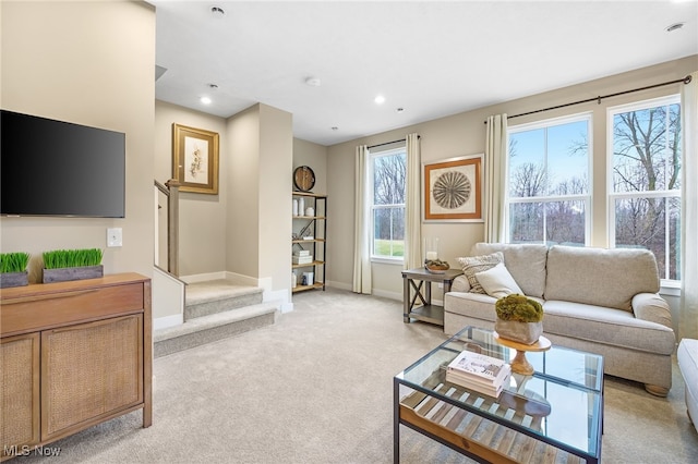 carpeted living room featuring a healthy amount of sunlight