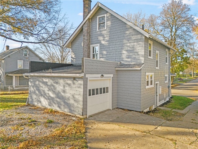 view of property exterior with a garage