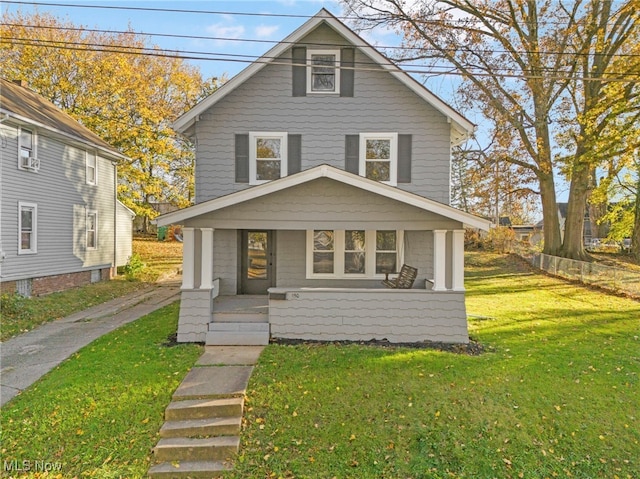 view of front property featuring a porch and a front lawn