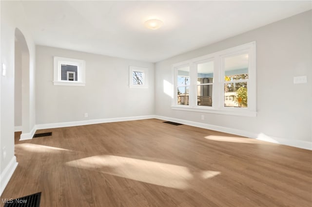 spare room featuring hardwood / wood-style floors