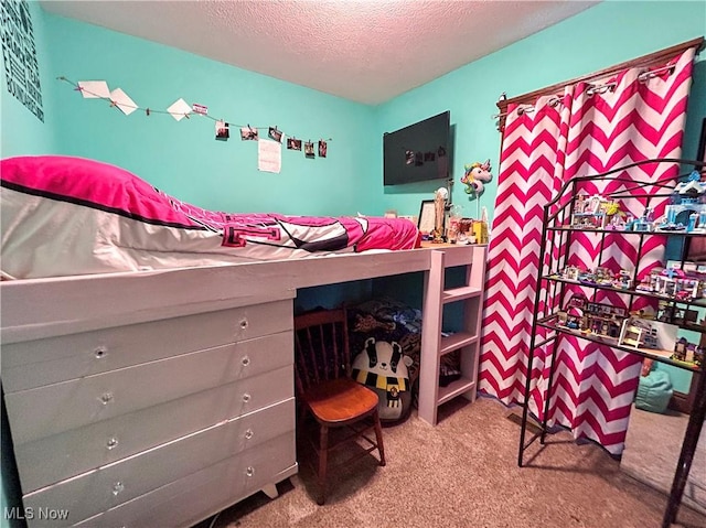 carpeted bedroom with a textured ceiling