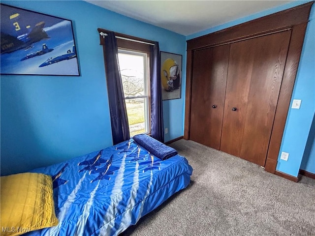 carpeted bedroom featuring a closet