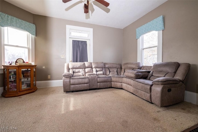 carpeted living room featuring ceiling fan