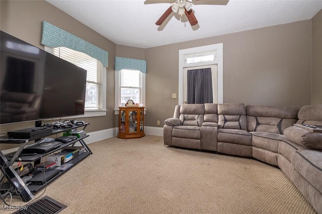 living room featuring carpet flooring and ceiling fan