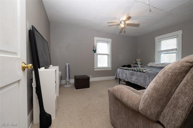 bedroom featuring ceiling fan and a textured ceiling