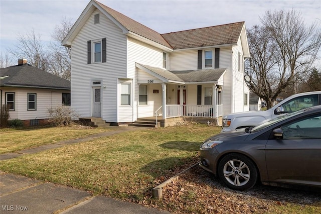 view of front property with covered porch and a front yard